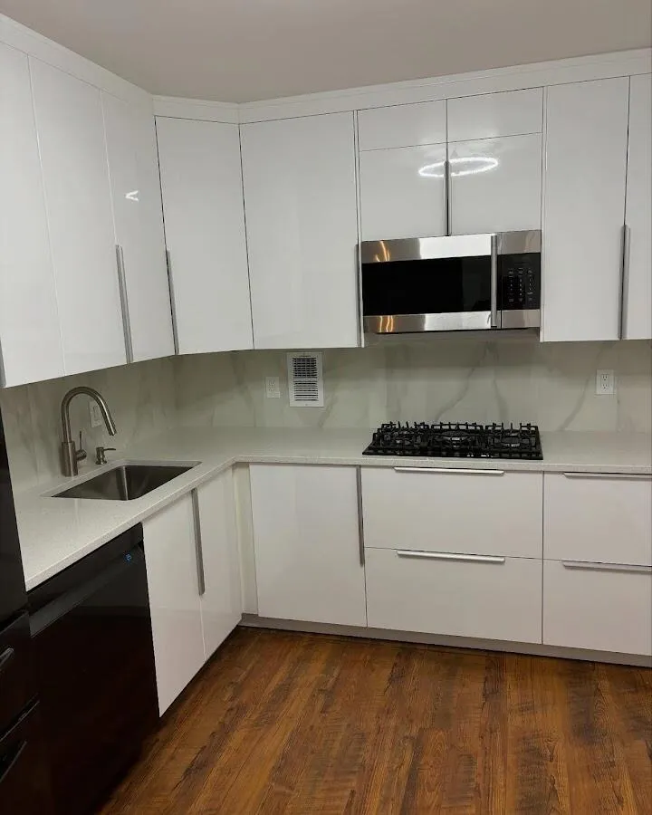 Restored kitchen with white cabinets after water damage in Harvey